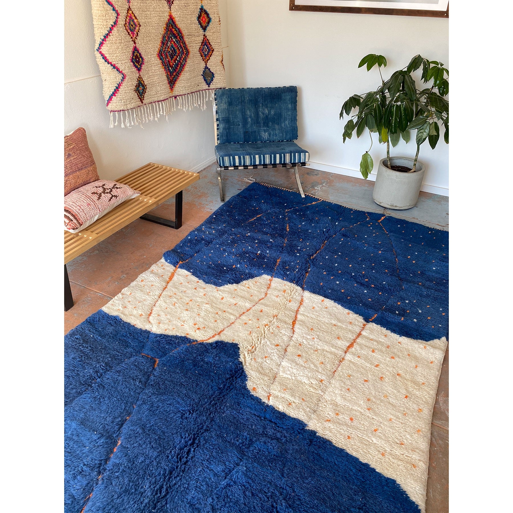 Contemporary blue and white Moroccan rug featured in a bohemian space - Kantara | Moroccan Rugs