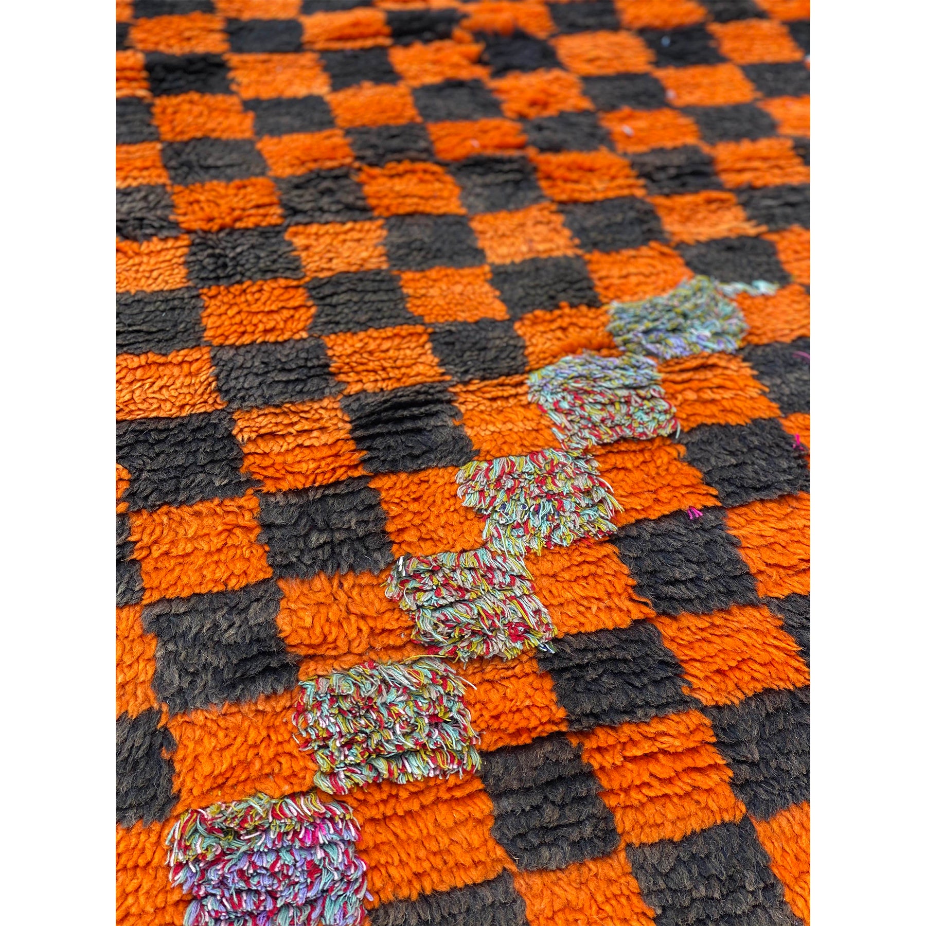 Hand woven wool Moroccan checkerboard print rug in orange and black - Kantara | Moroccan Rugs