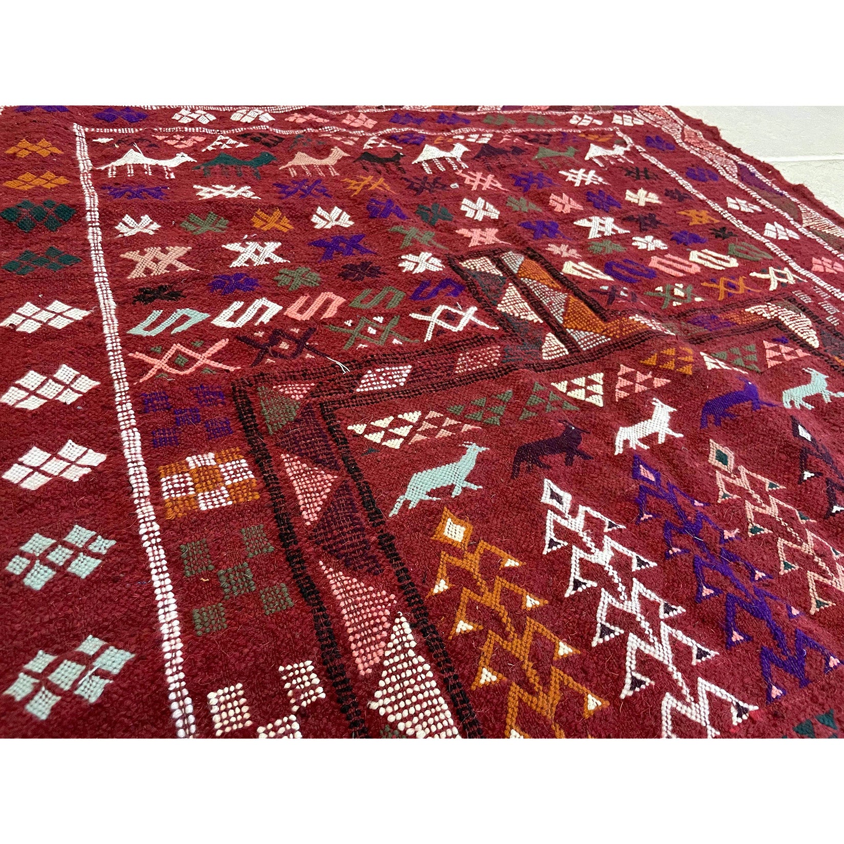 Boujad tribal Moroccan Berber rug with animal and plant motifs  | Kantara Moroccan Rugs in Los Angeles