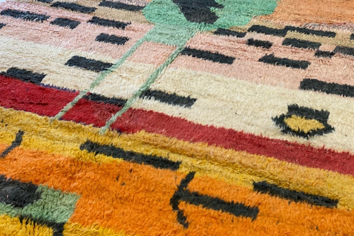 Colorful orange, yellow and peach Moroccan rug with black abstract lines