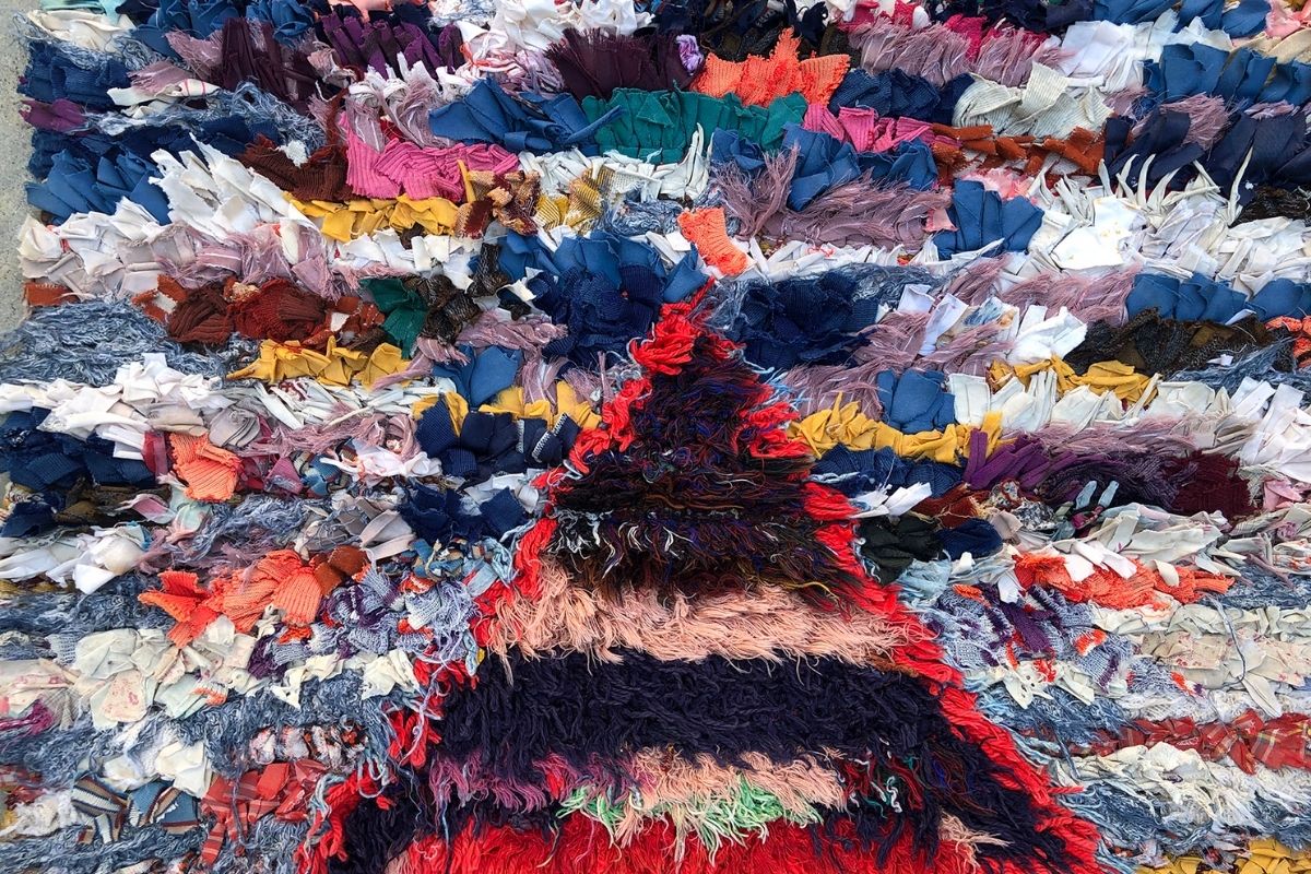 Colorful Moroccan boucherouite rag rug with triangular motif