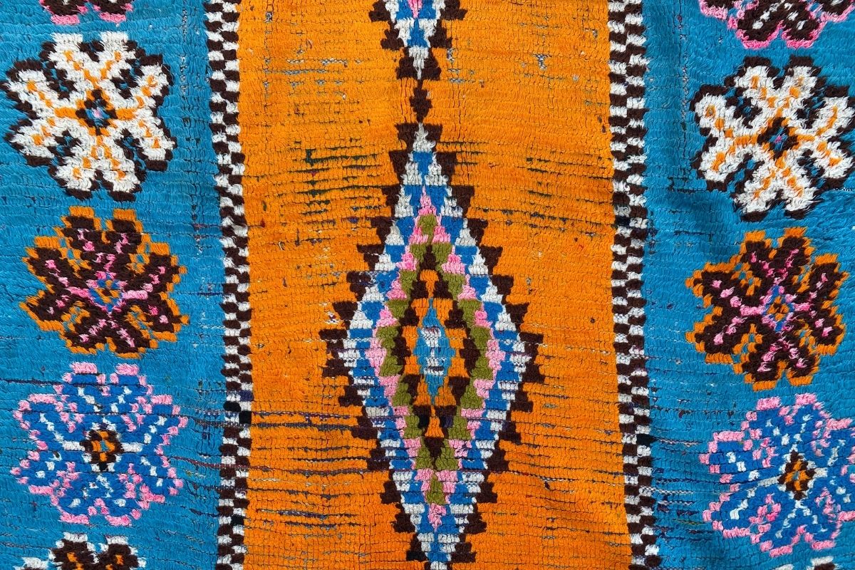 Blue and orange Moroccan boucherouite rug with central diamond design