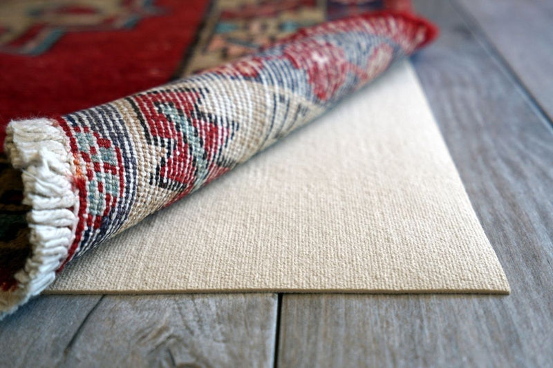 https://kantararugs.com/cdn/shop/articles/things-to-keep-in-mind-when-buying-a-rug-pad_800x800.jpg?v=1634929069