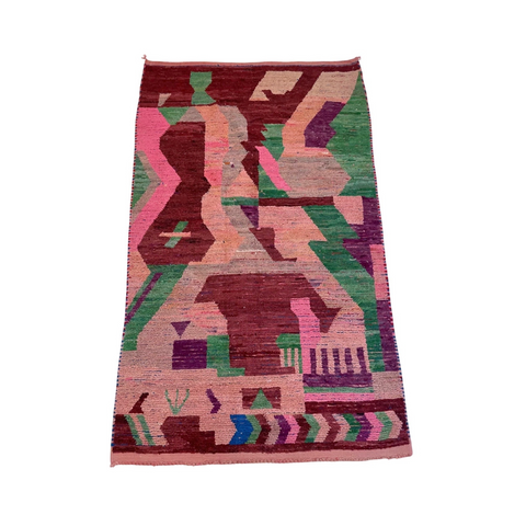 Red, maroon, green, and pink vintage 5x7 Moroccan rug in kantara's los angeles collection