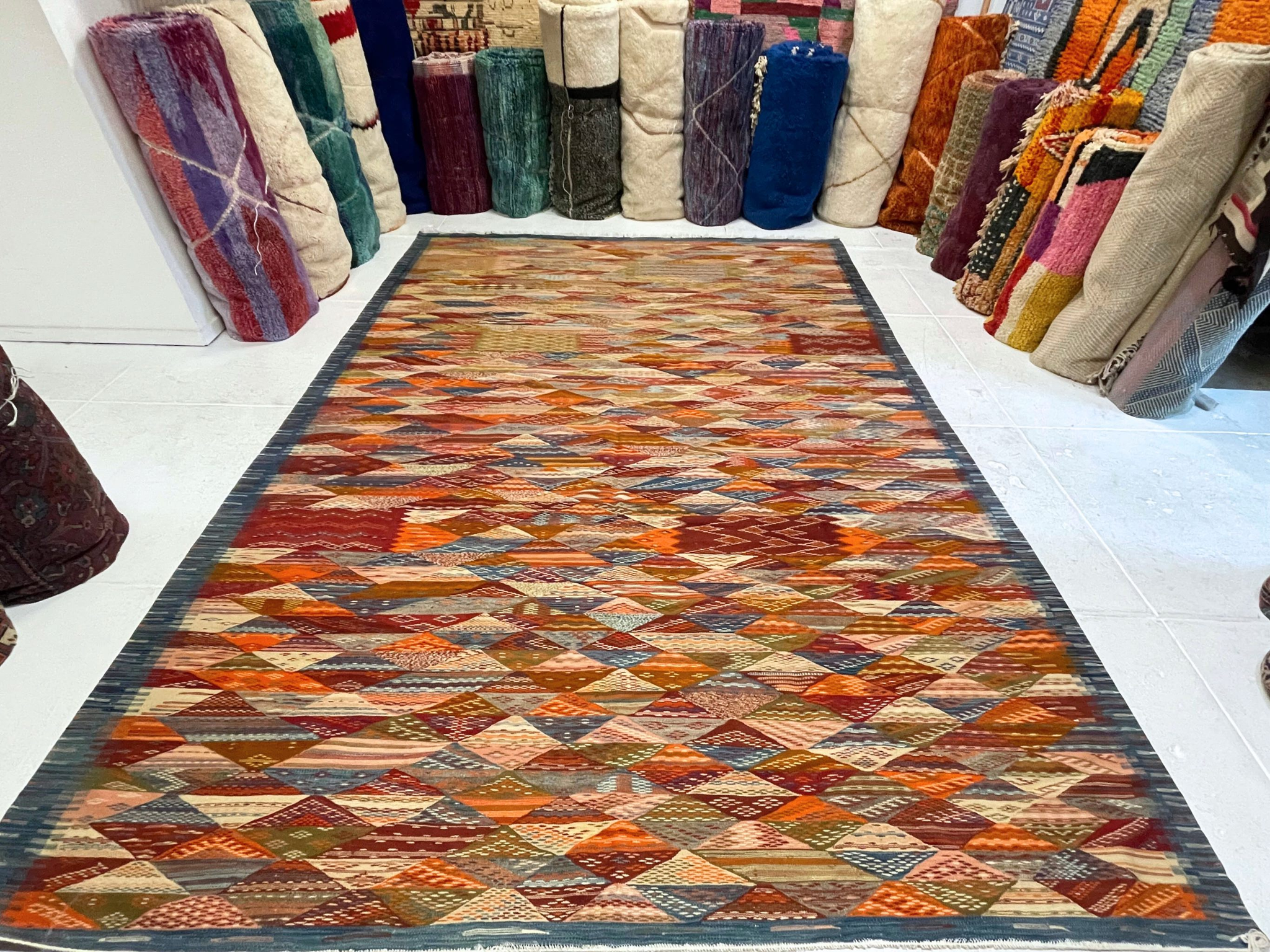 Moroccan flatweave kilim area rug in reds, oranges, and yellows