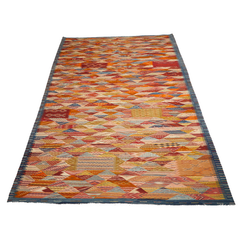 Moroccan flatweave kilim area rug in reds, oranges, and yellows
