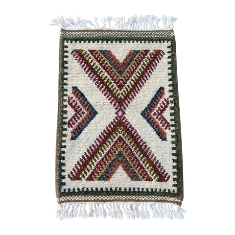 White Moroccan throw rug with traditional design