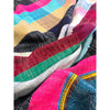 Close-up of colorful fabric with various patterns and colors.