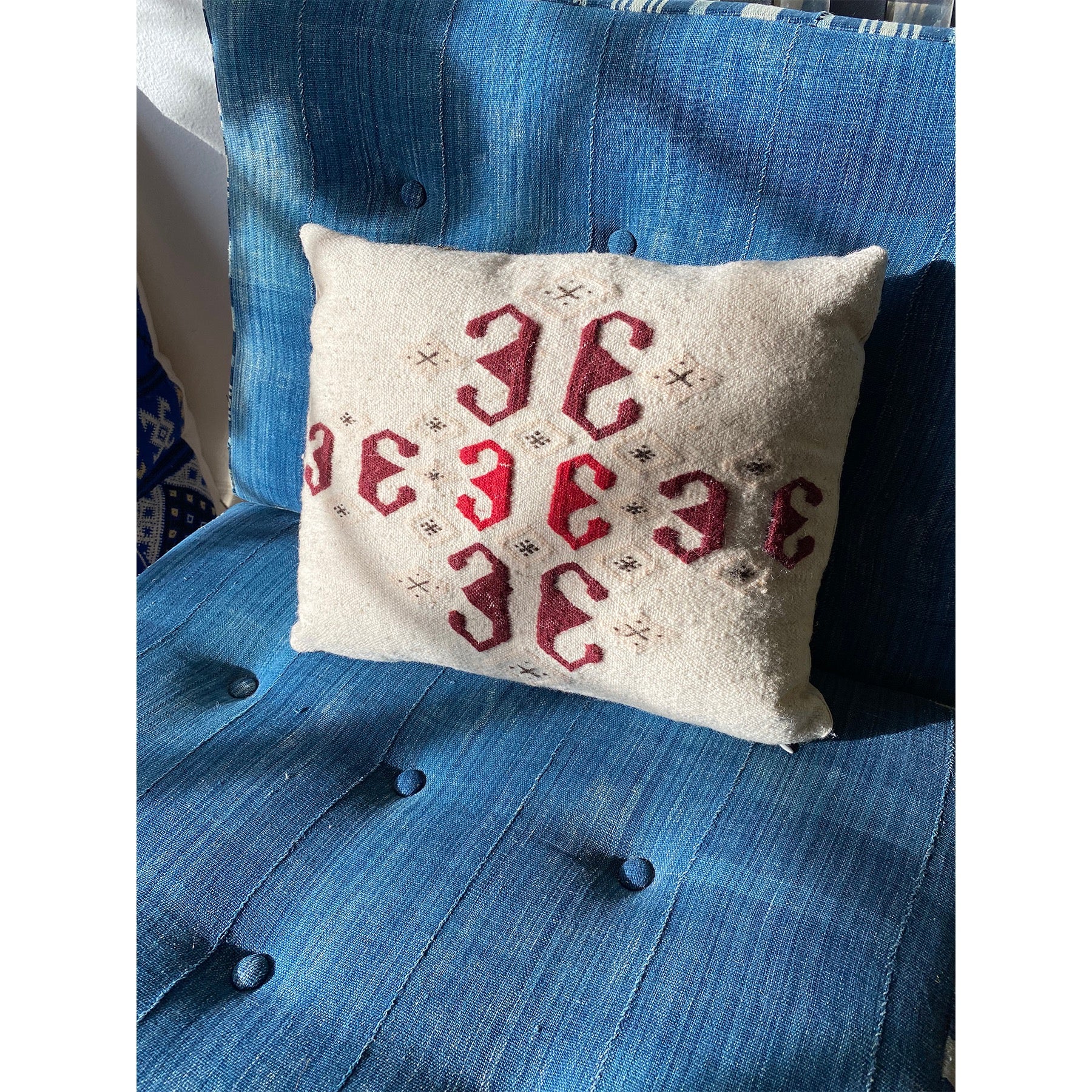 Modern Moroccan pillow in reds