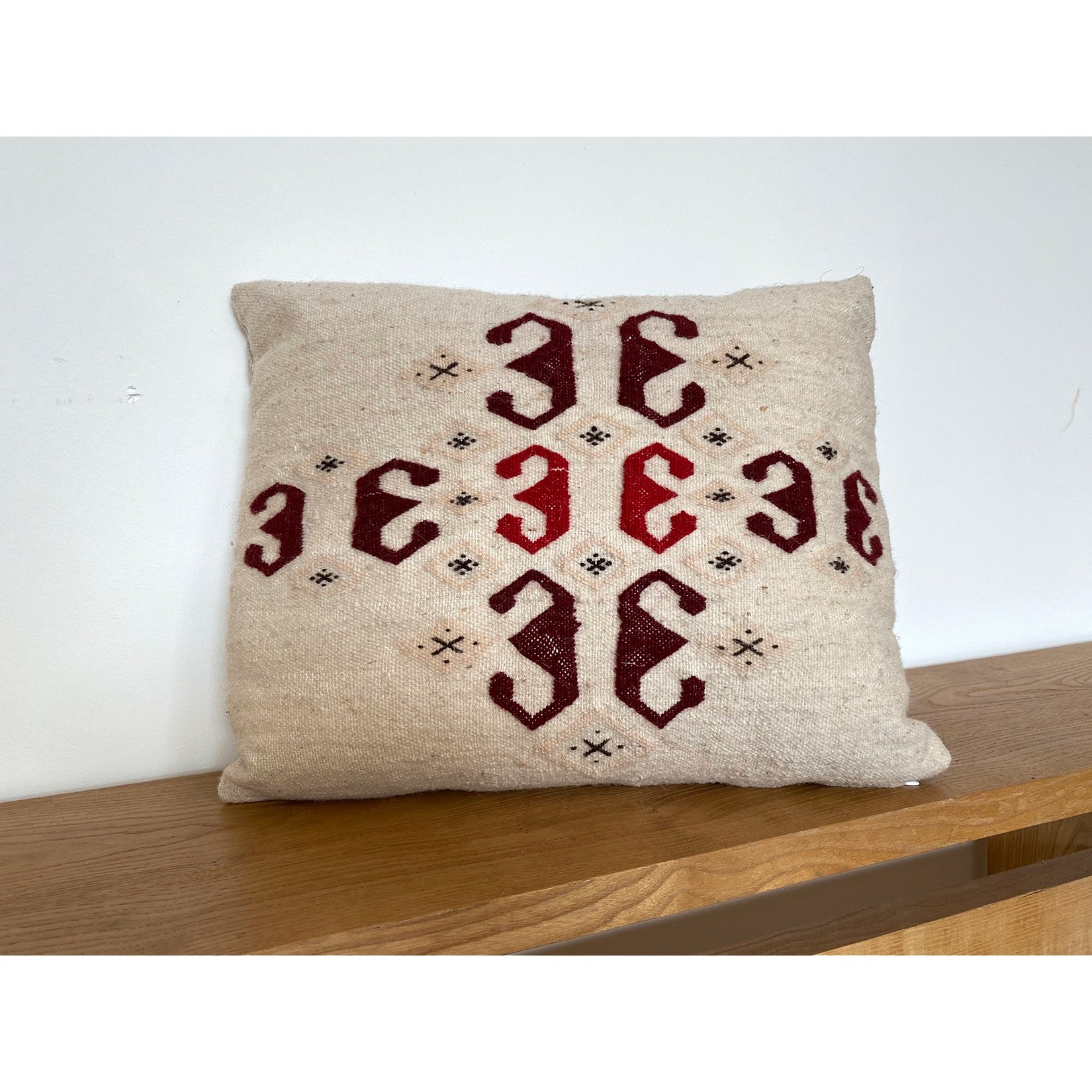Modern Moroccan pillow in reds