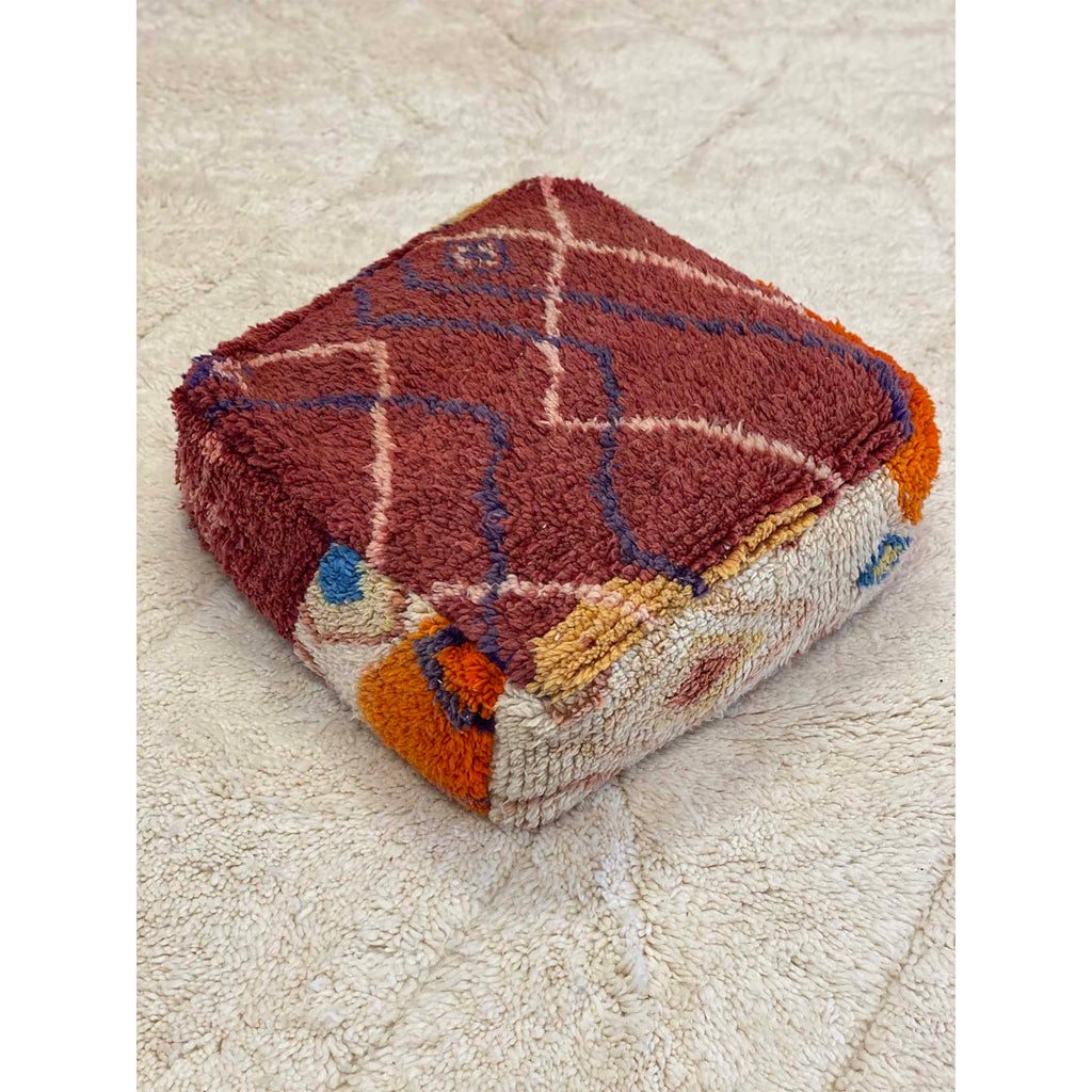 Boho chic red, orange, and white Moroccan floor pouf pillow - Kantara | Moroccan Rugs