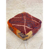 Boho chic red, orange, and white Moroccan floor pouf pillow - Kantara | Moroccan Rugs