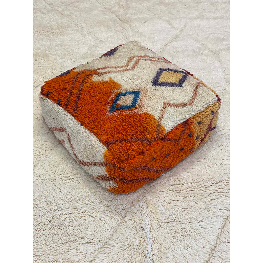 Colorful floor pouf made from upcycled orange and white Moroccan rug - Kantara | Moroccan Rugs