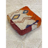 Colorful floor pouf made from upcycled orange and white Moroccan rug - Kantara | Moroccan Rugs
