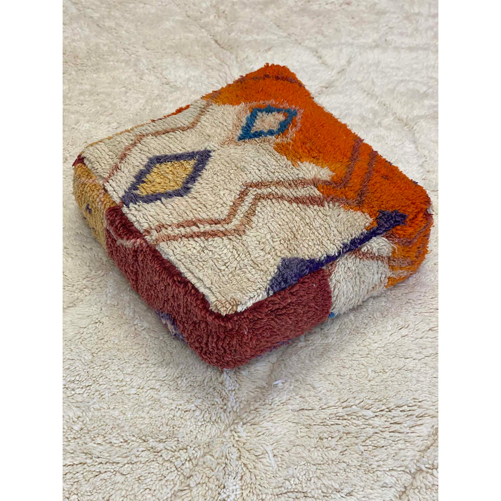 Colorful floor pouf made from upcycled orange and white Moroccan rug - Kantara | Moroccan Rugs