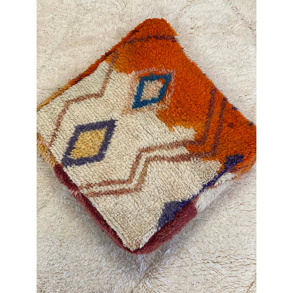 Colorful floor pouf made from upcycled orange and white Moroccan rug - Kantara | Moroccan Rugs