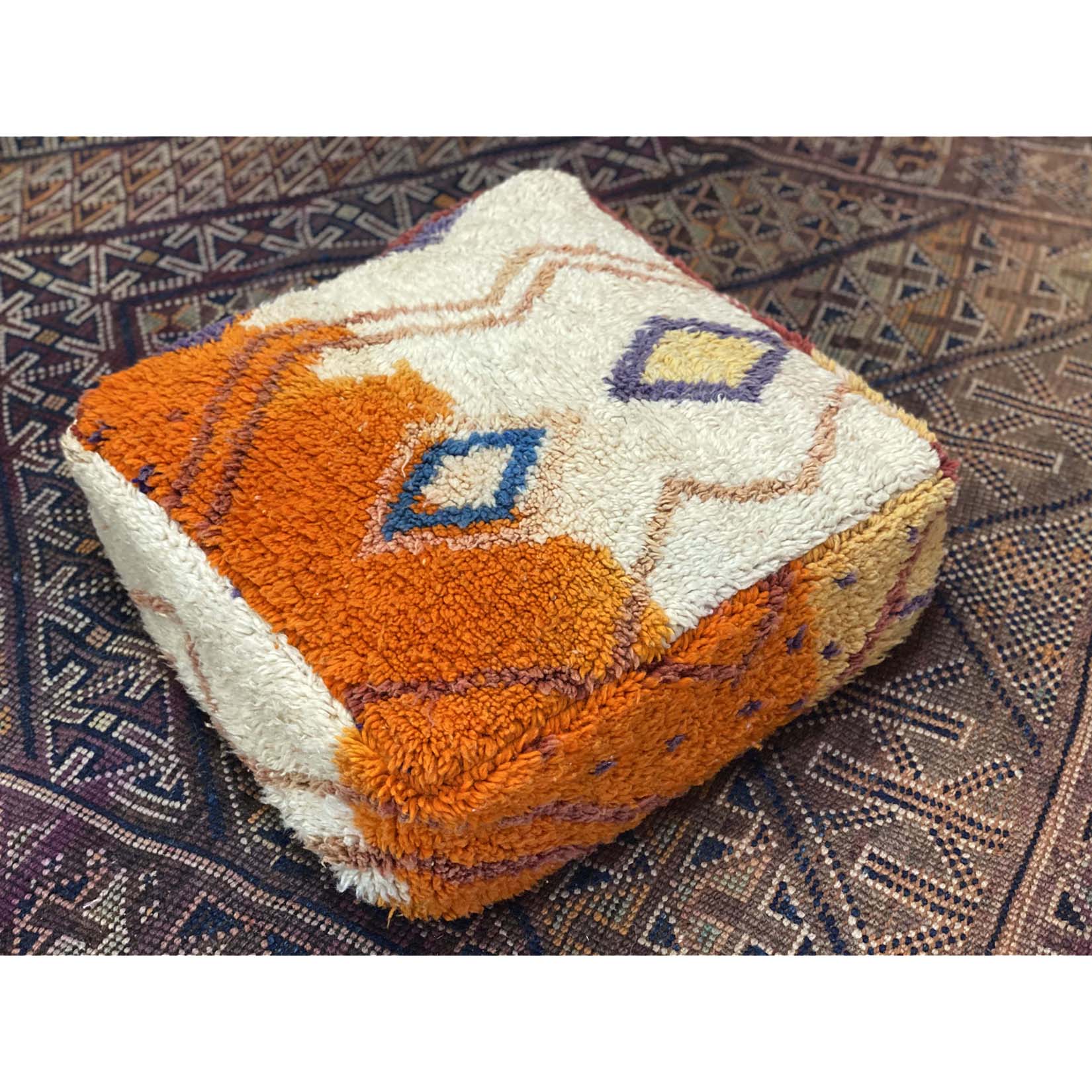 Colorful floor pouf made from upcycled orange and white Moroccan rug - Kantara | Moroccan Rugs