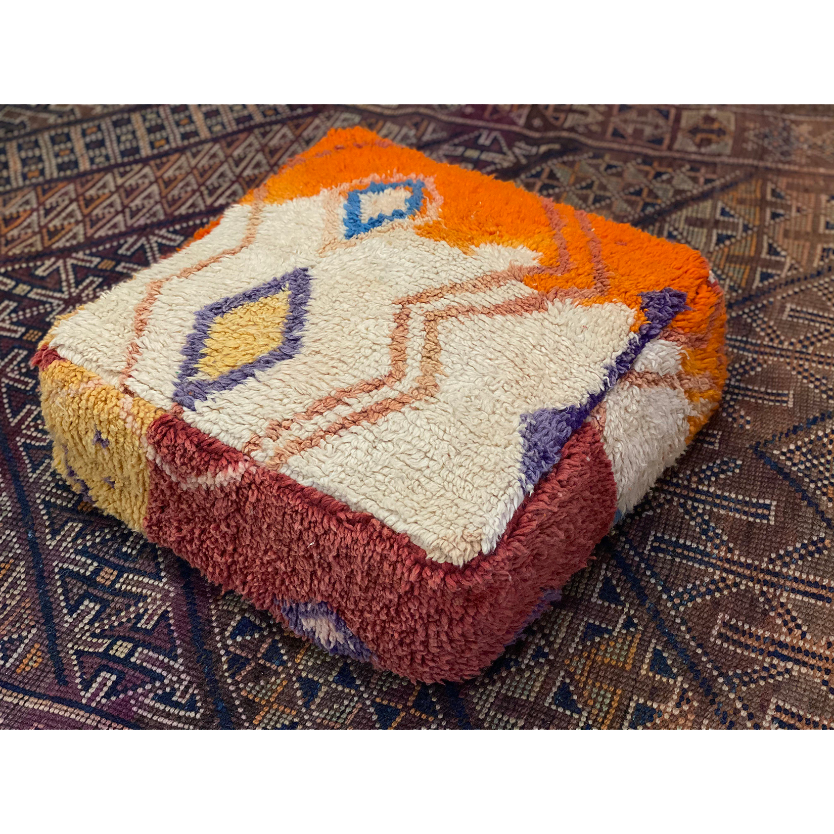 Colorful floor pouf made from upcycled orange and white Moroccan rug - Kantara | Moroccan Rugs