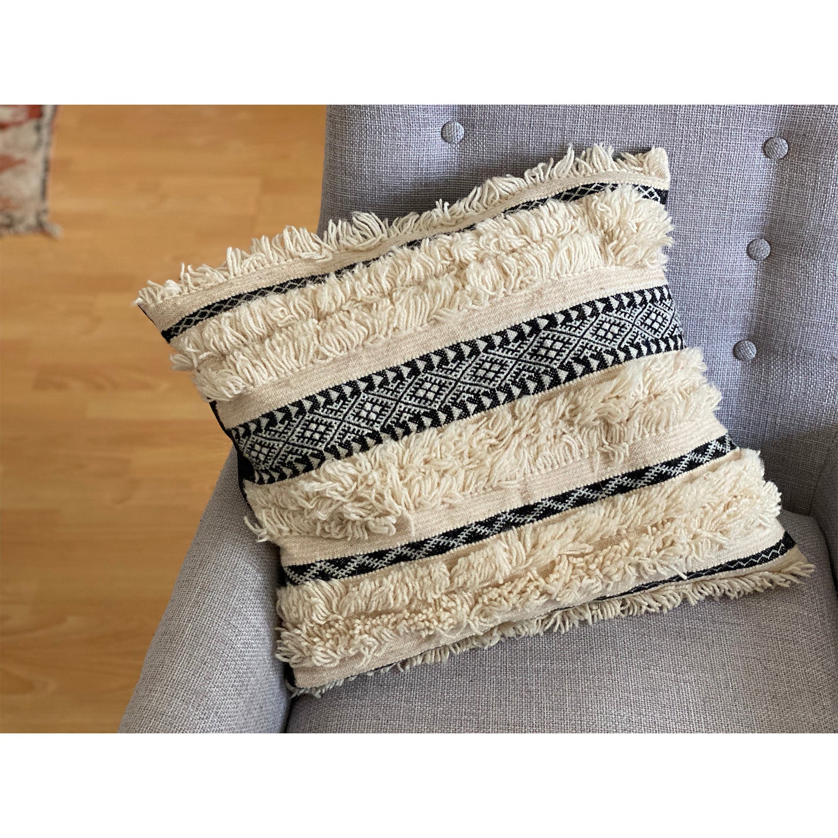 Moroccan pillow inspired by Moroccan wedding blanket in black and white and tufted bands