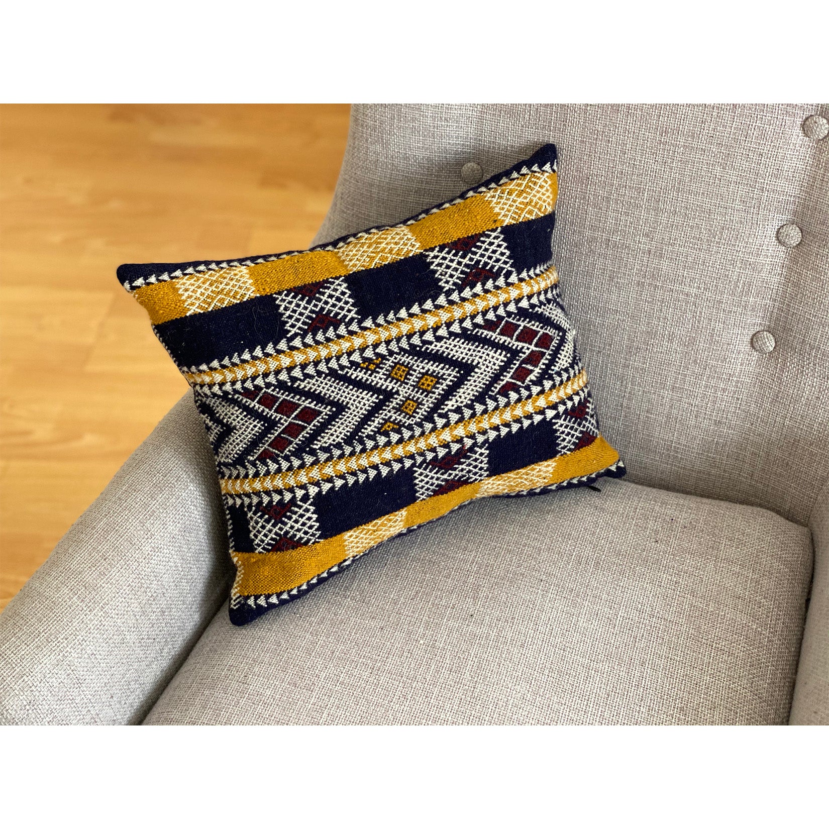 Black and mustard Moroccan pillow made by Kantara weavers in Morocco
