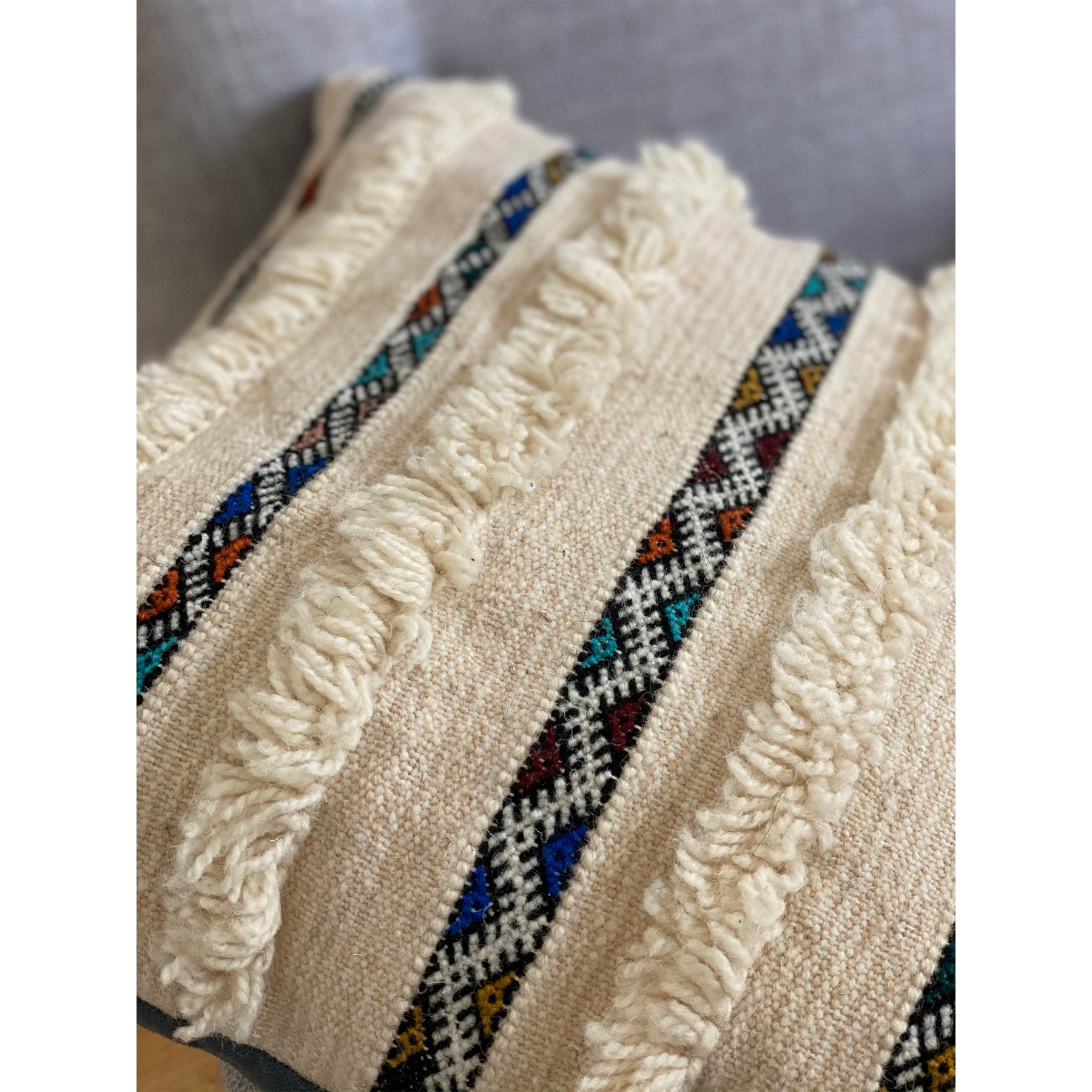 Closeup of Handira Moroccan wedding blanket pillow made by Kantara artisans in Morocco