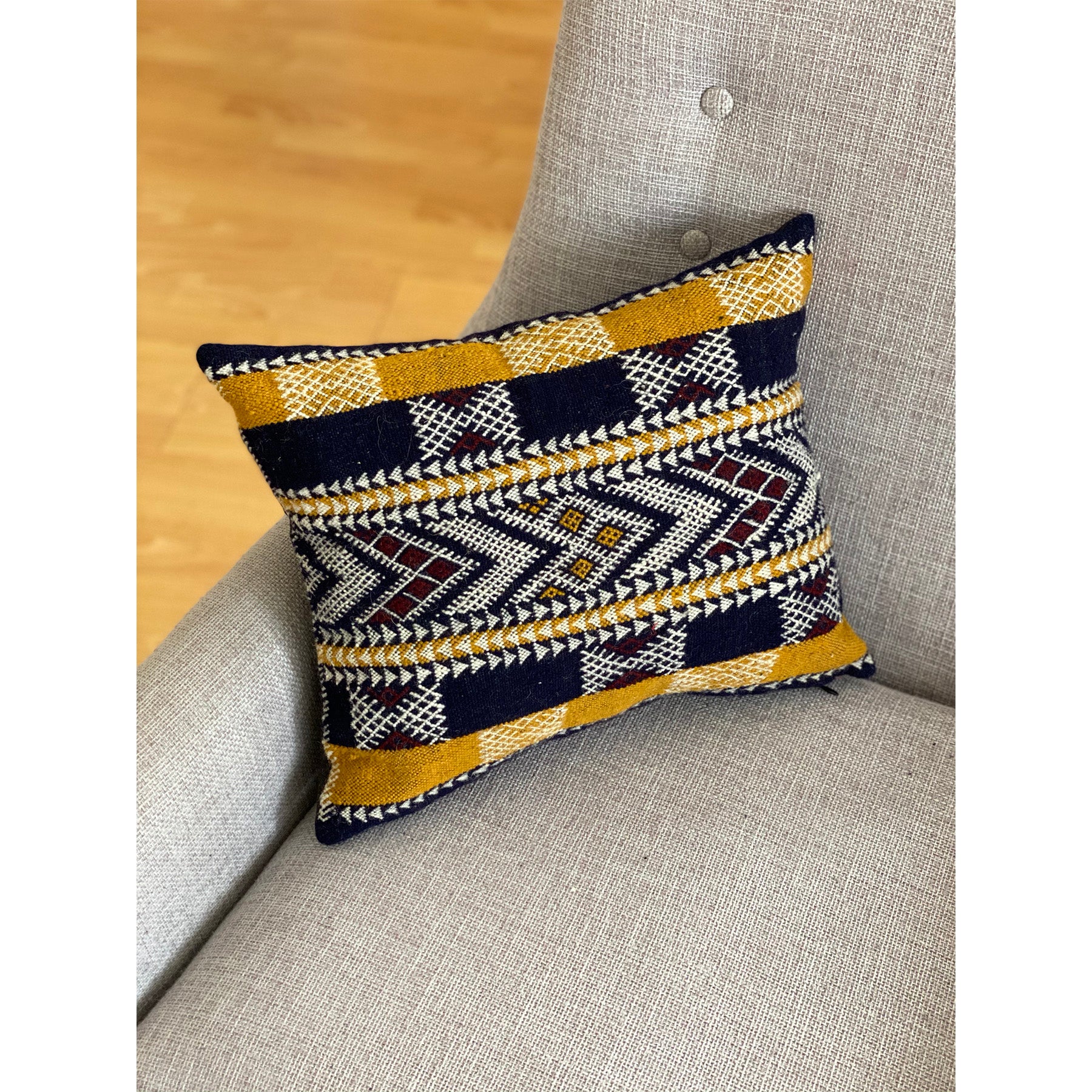 Black and mustard Moroccan pillow made by Kantara weavers in Morocco