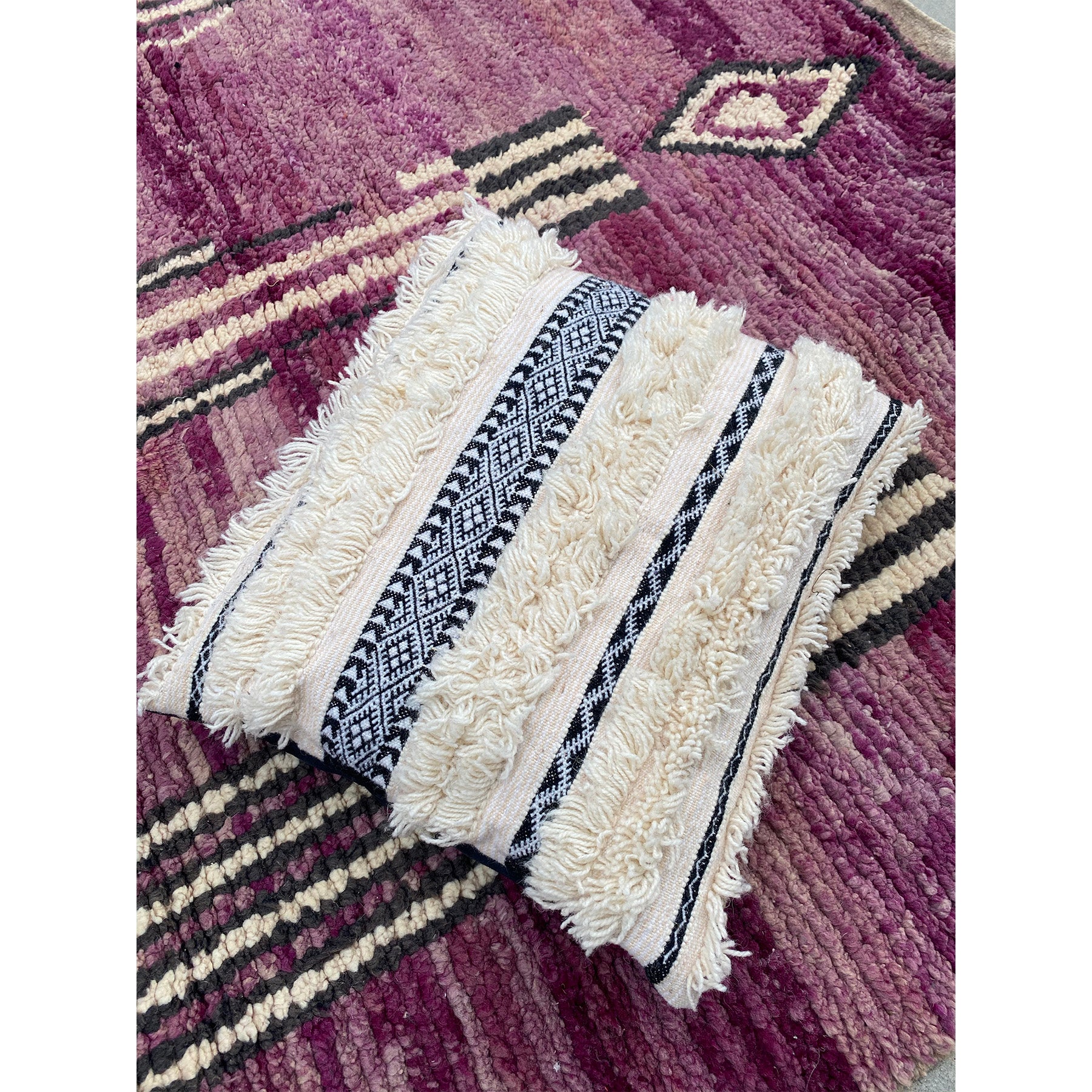 Moroccan pillow made from modern version of handira wedding blanket