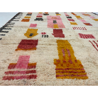 Detail of Modern Berber rug with pink and yellow designs