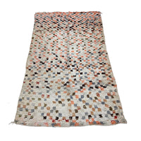 White checkerboard Moroccan rug with pink details - Kantara | Moroccan Rugs