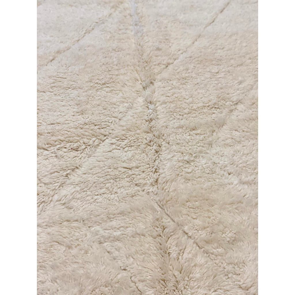 Plush cream-colored Moroccan rug with minimal pattern design - Kantara | Moroccan Rugs