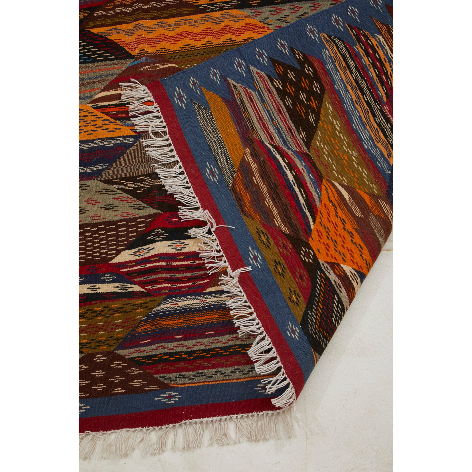Moroccan flatweave kilim area rug with red, yellow, orange, and blue details - Kantara | Moroccan Rugs