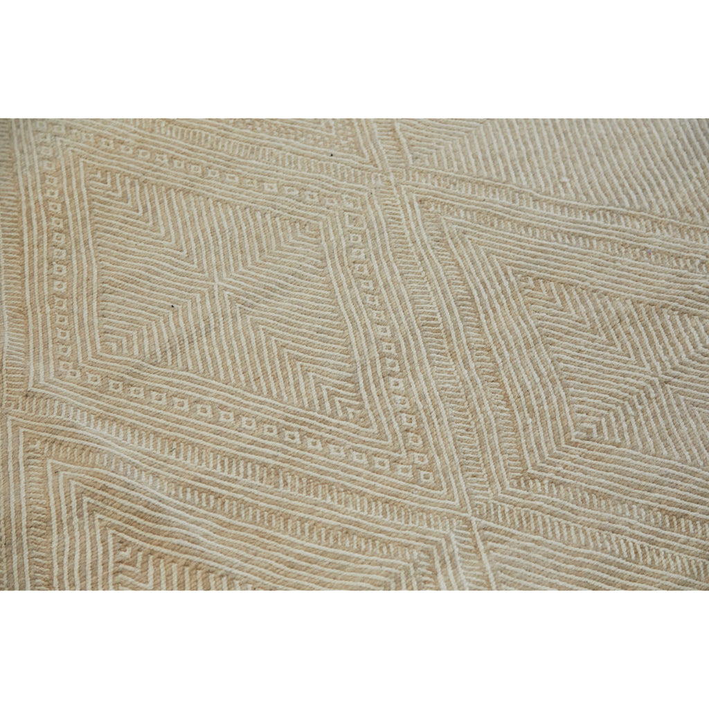 Neutral Moroccan flatweave rug in ecru tones ideal for dining room