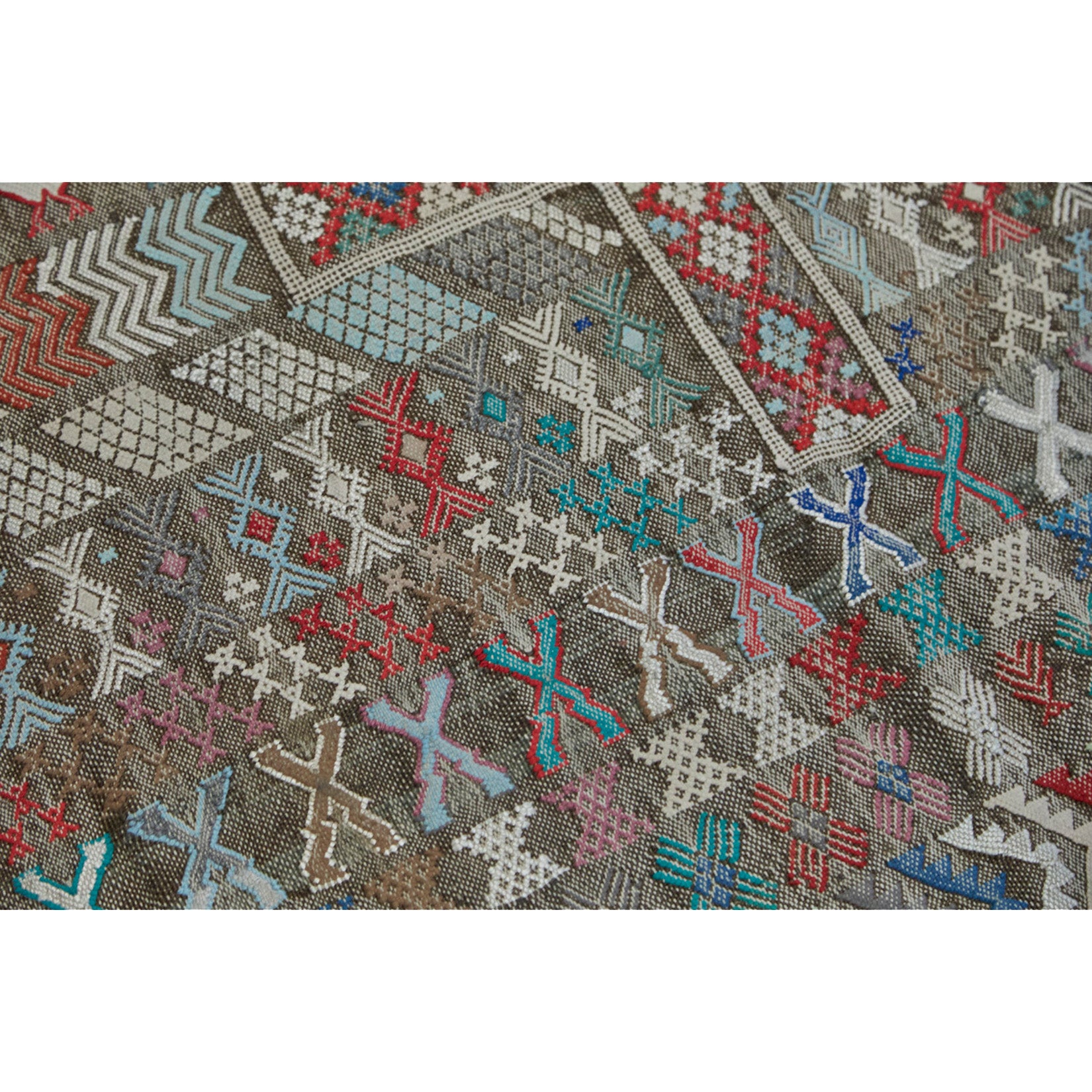 Moroccan kilim with animal motifs in shades of blue, red, white, and green - Kantara | Moroccan Rugs
