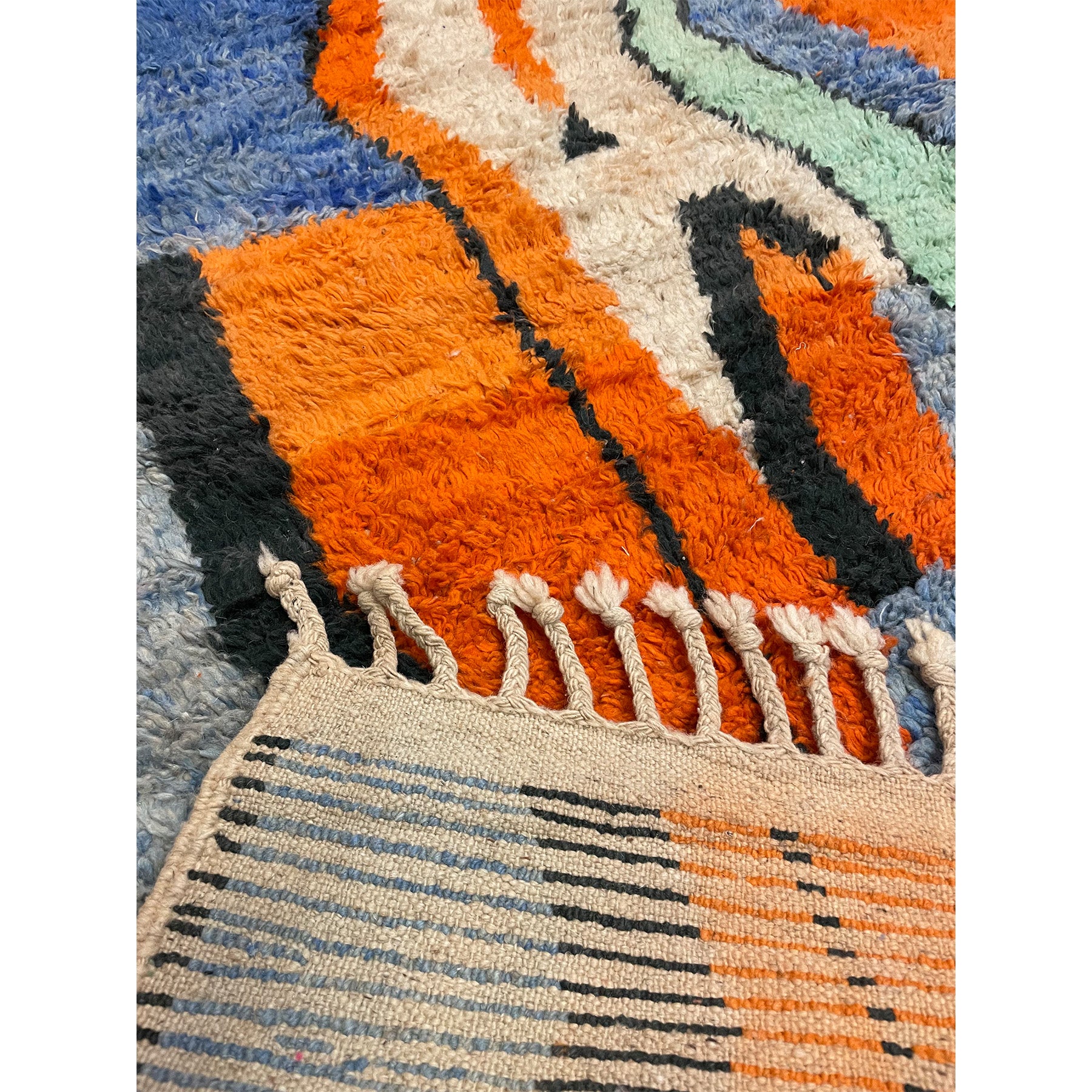 Abstract Moroccan rug in orange, blue, white, black, and sea foam green - Kantara | Moroccan Rugs