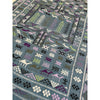 close up detail of kilim rug with camels in olive green, purple, light pink and white  | Kantara Moroccan Rugs in Los Angeles