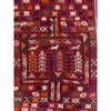 Traditional medium sized Moroccan rug in dark red color with details in purple, olive green, pink, and orange  | Kantara Moroccan Rugs in Los Angeles