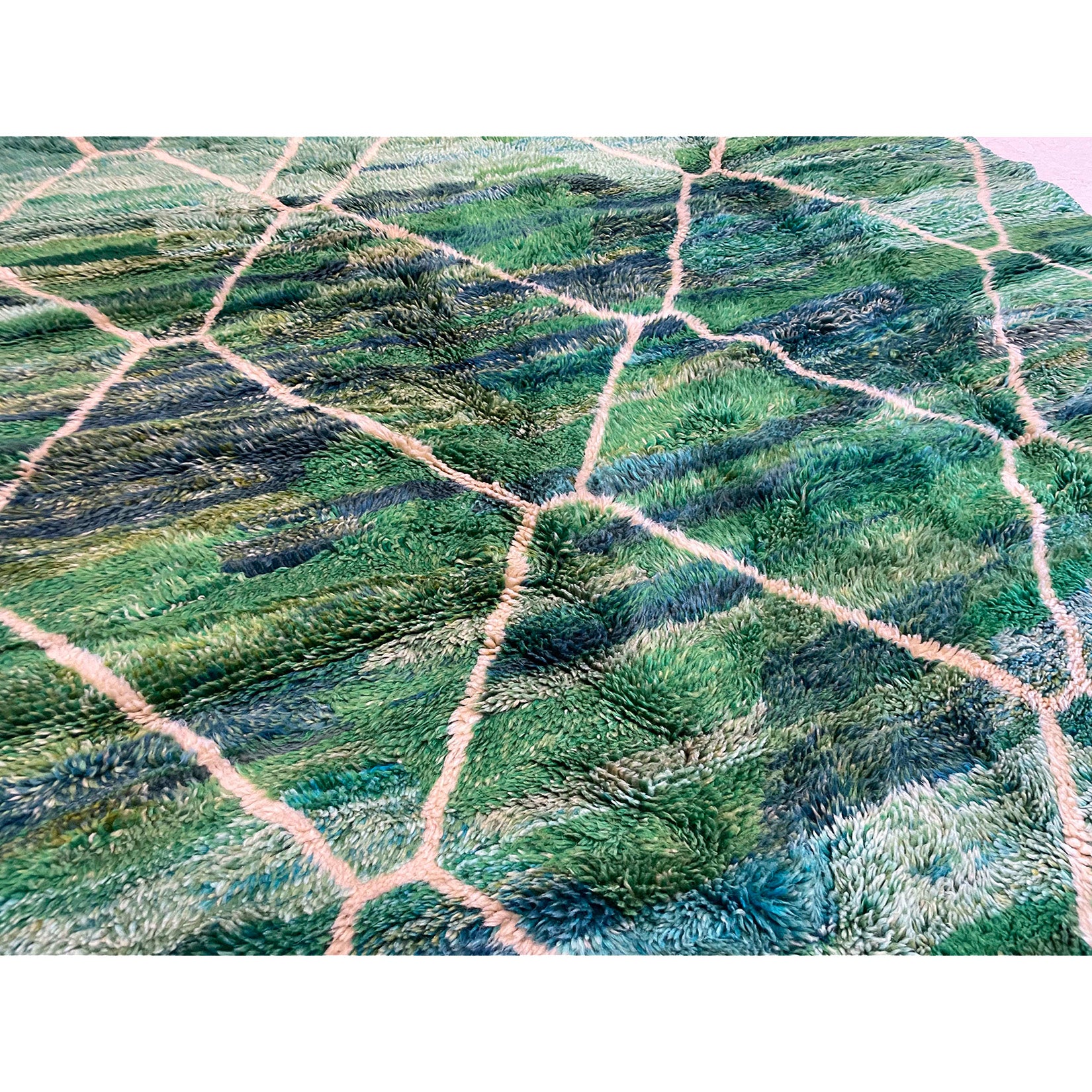 Tightly woven plush green and blue Moroccan berber rug with contemporary colors and Beni Ourain linework in white  | Kantara Moroccan Rugs in Los Angeles at The Rug Shop