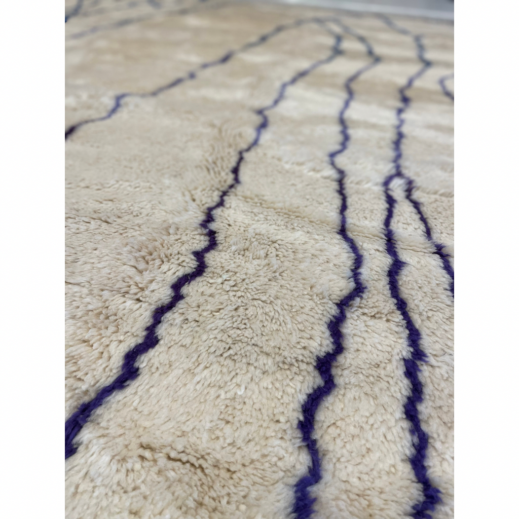 Minimalist Moroccan bedroom rug with blue and purple details - Kantara | Moroccan Rugs