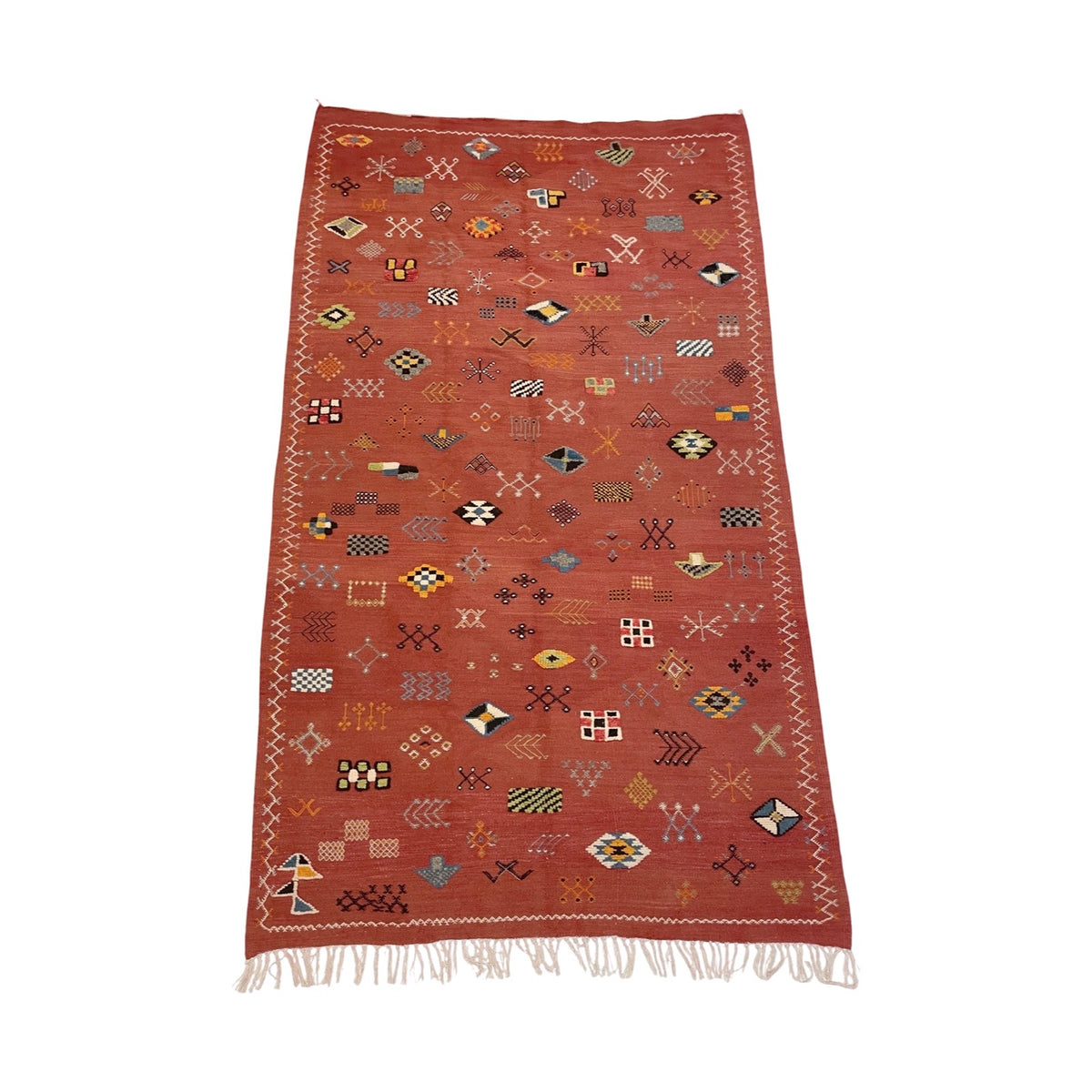 Faded red Moroccan flatweave rug with playful motifs– Kantara ...