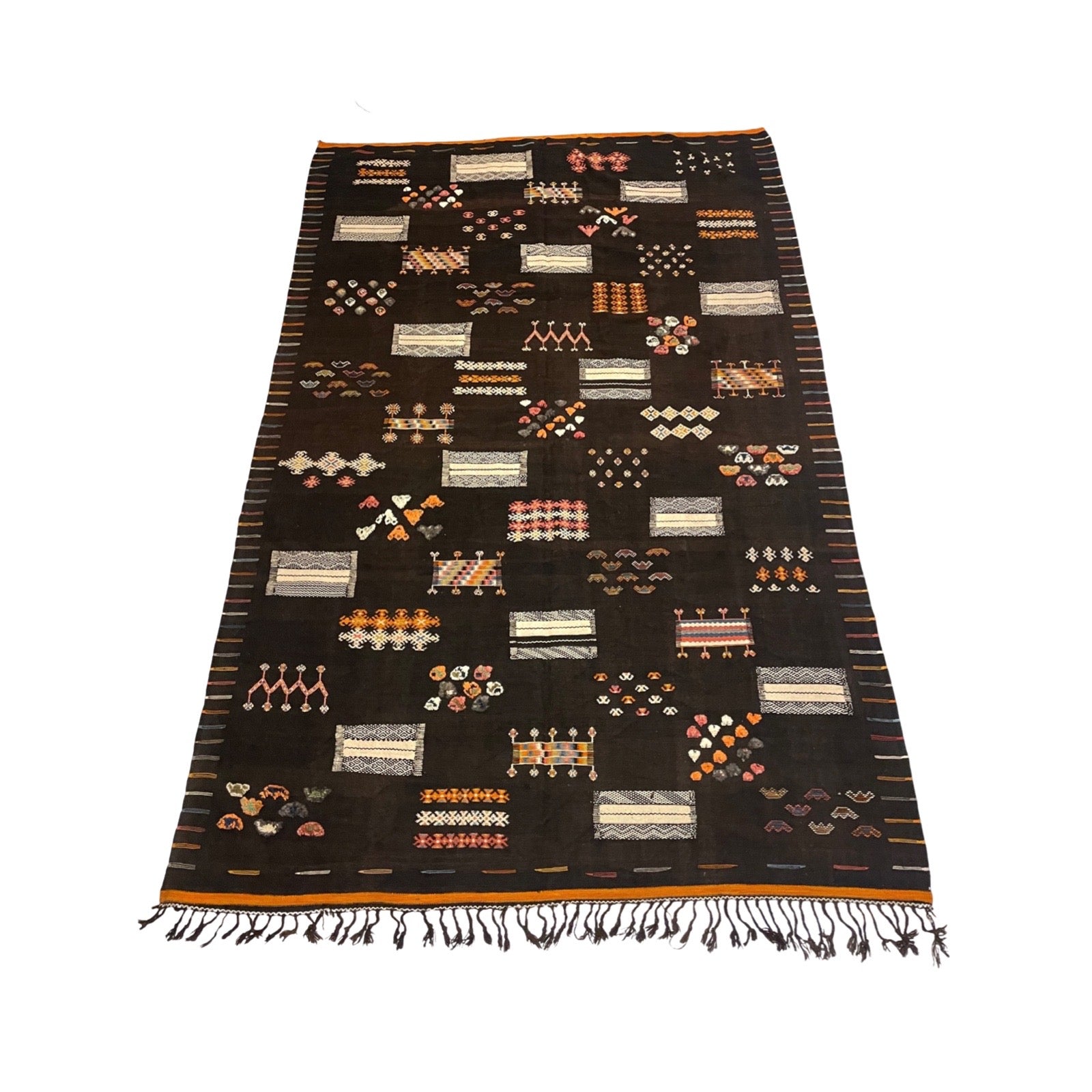 Black Moroccan rug with orange and cream details - Kantara | Moroccan Rugs