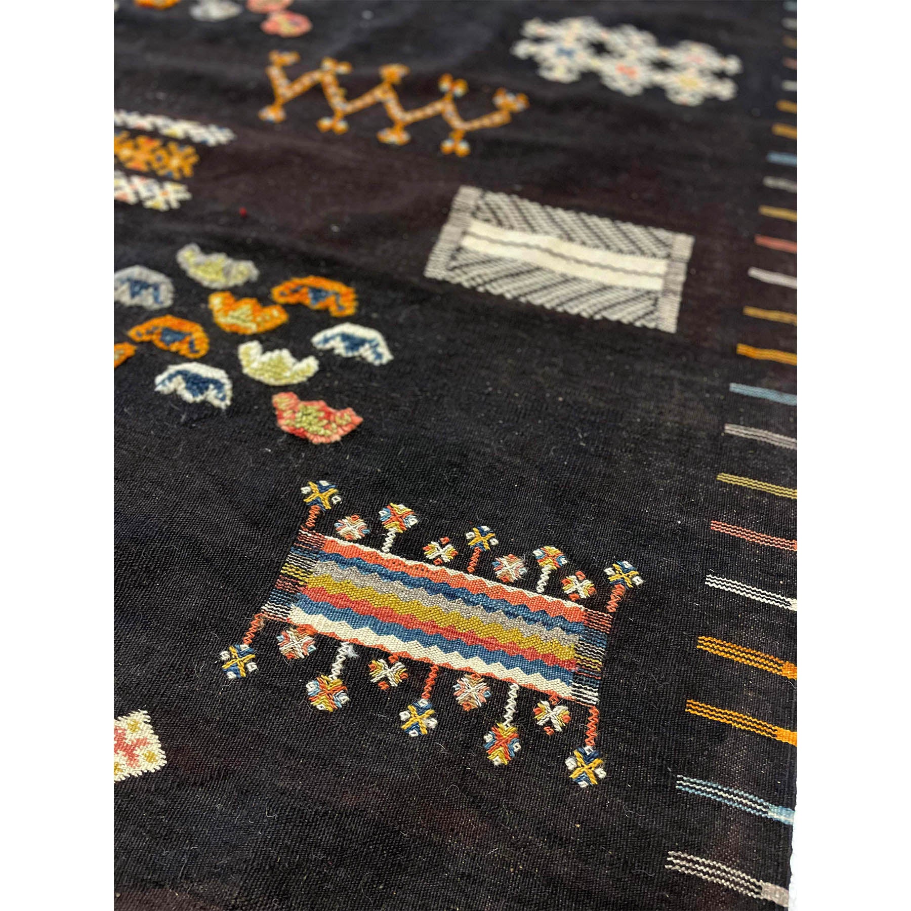 Colorful dark Moroccan area rug with tribal motifs - Kantara | Moroccan Rugs