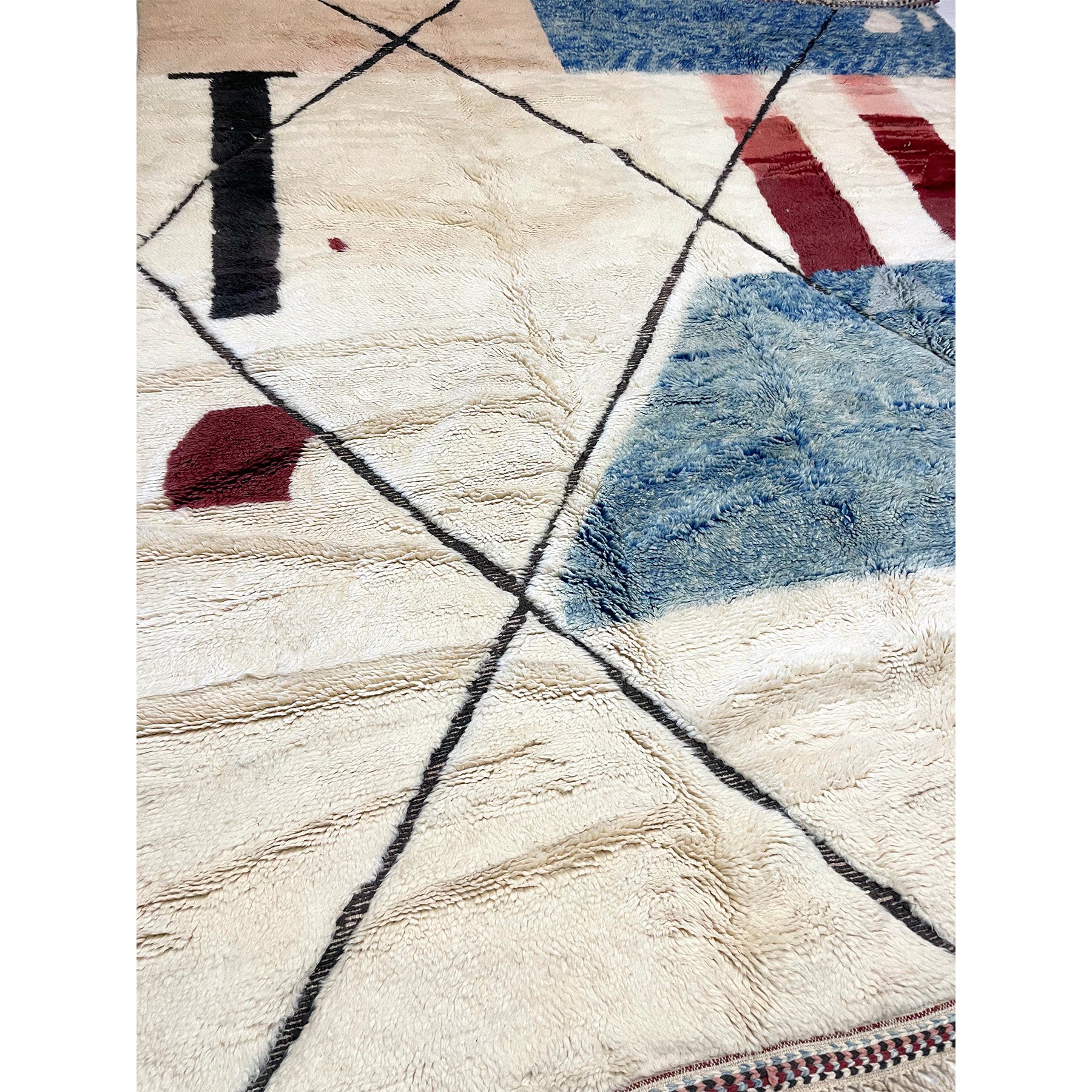 Large Moroccan trellis rug in white with blue and red details - Kantara | Moroccan Rugs